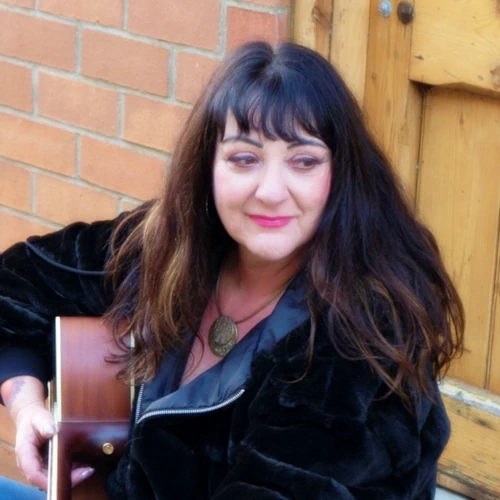 Liz Lenten (Host)